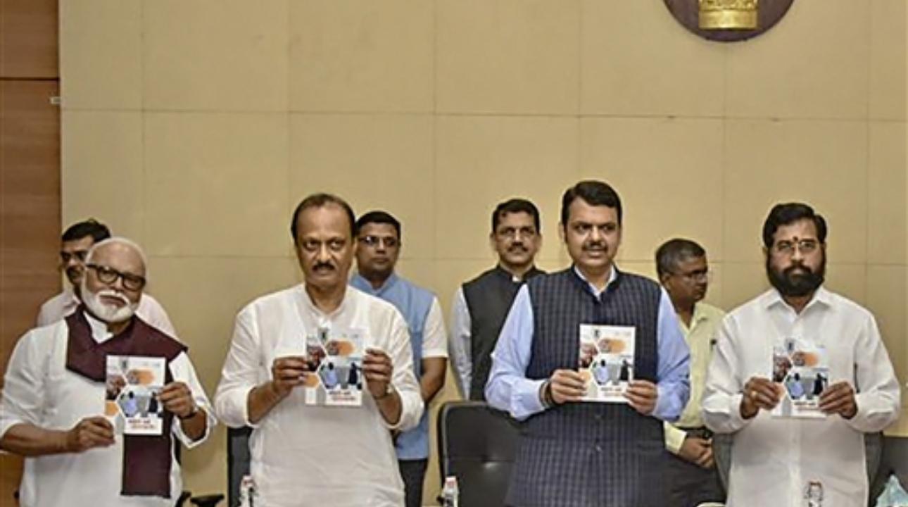 Maharashtra Chief Miniter Eknath Shinde with Deputy Chief Ministers Devendra Fadnavis and Ajit Pawar, NCP leader Chhagan Bhujbal and others releases a booklet, in Mumbai
 