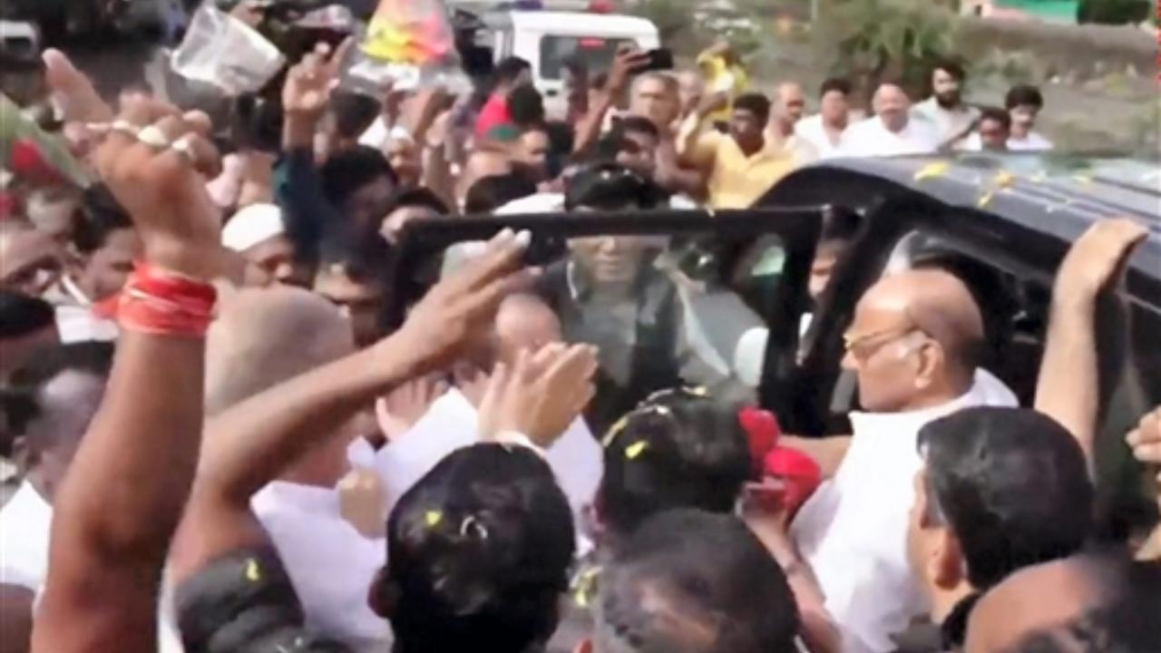 NCP Chief Sharad Pawar being welcomed by supporters as he reached Khed-Shivapur toll plaza on Pune-Satara Highway while on his way to Karad
 