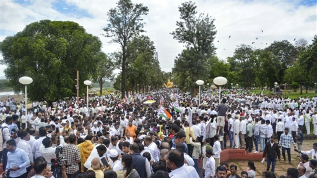 Supporters gather to welcome NCP Chief Sharad Pawar on his arrival at the memorial of former Maharashtra chief minister Yashwantrao Chavan, in Karad
 