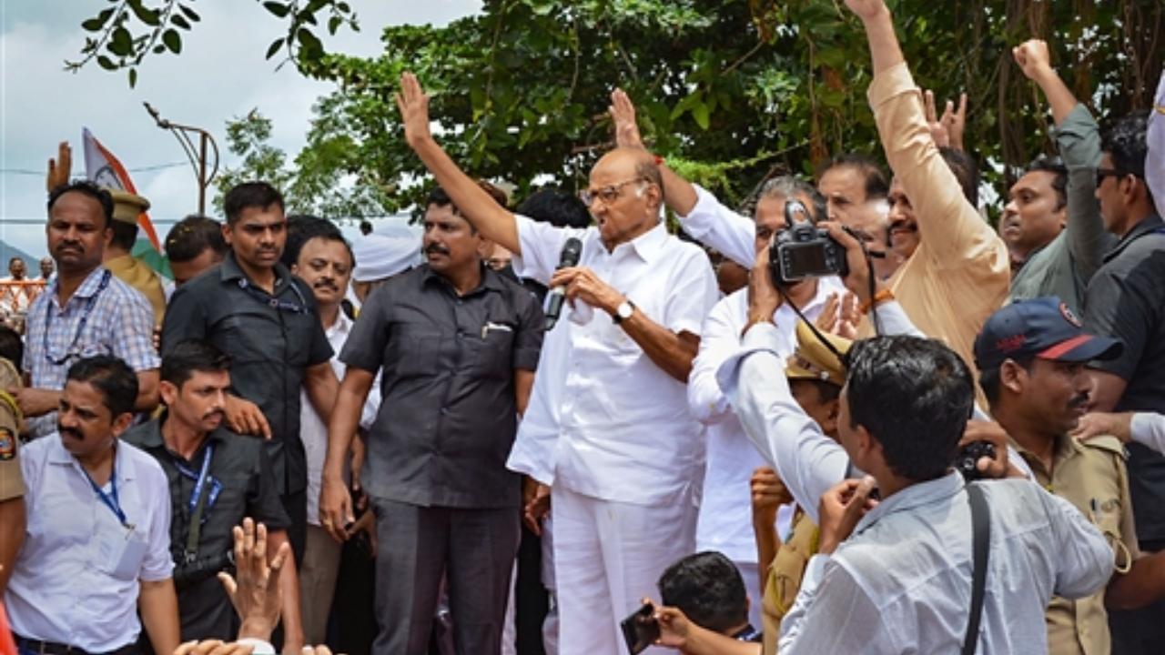 NCP Chief Sharad Pawar addresses supporters after paying tribute to former Maharashtra chief minister Yashwantrao Chavan, in Karad
 