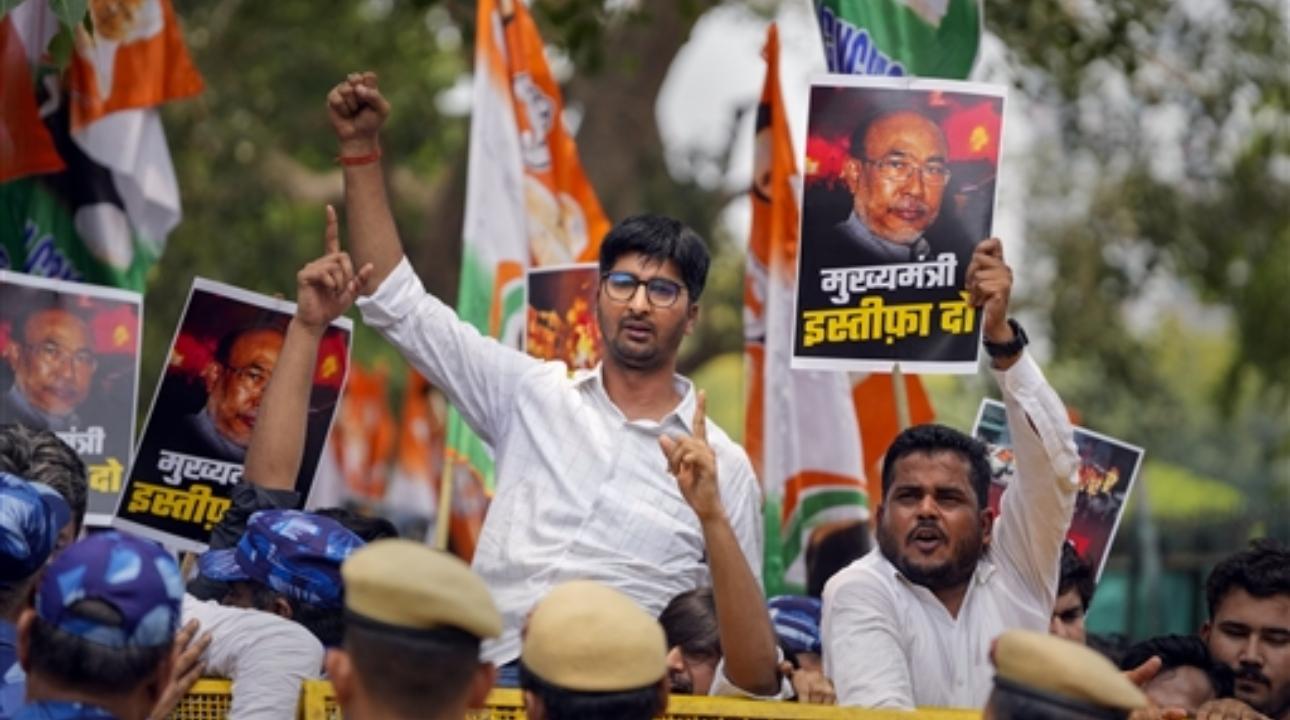 Indian Youth Congress (IYC) workers raise slogans during a protest demanding the resignation of Manipur Chief Minister N Biren Singh
 