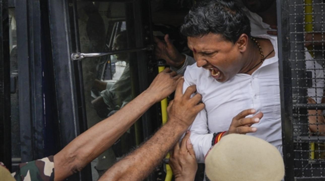 An Indian Youth Congress (IYC) President Srinivas BV being detained during a protest to demand the resignation of Manipur Chief Minister N Biren Singh, in New Delhi
 