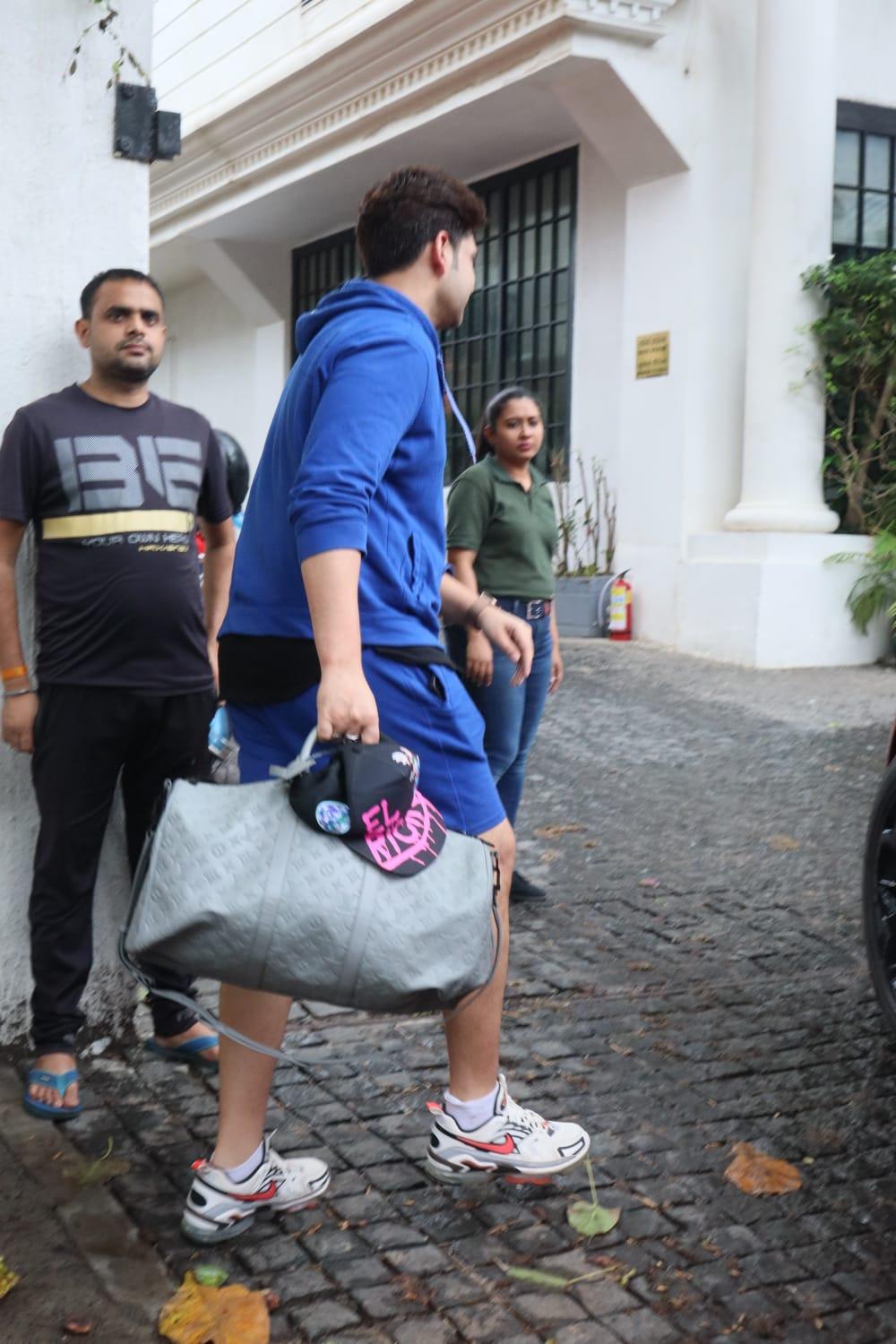  Karan looked anything but blue as he settled into his car, ready for his fitness routine