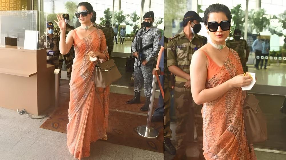 Kangana's confident aura resonated with the bold orange color, and she accessorized with a choker jewelry piece to accentuate the look.