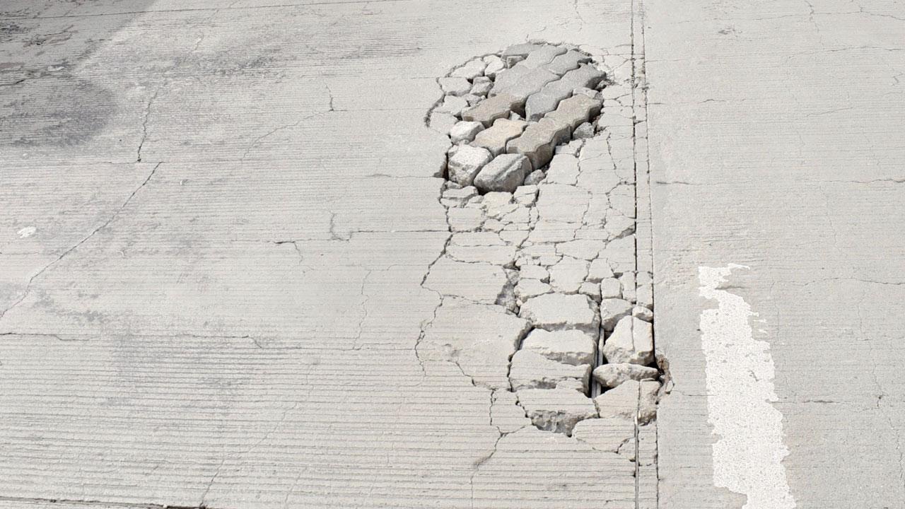 Cracks are seen on Kopri bridge, on Monday
