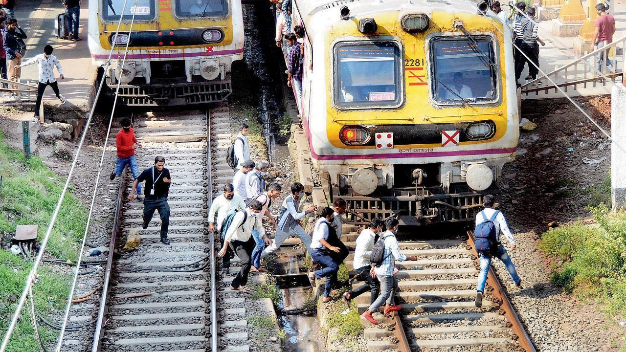 In Photos: Mumbai suburban trains running late due to signal failure