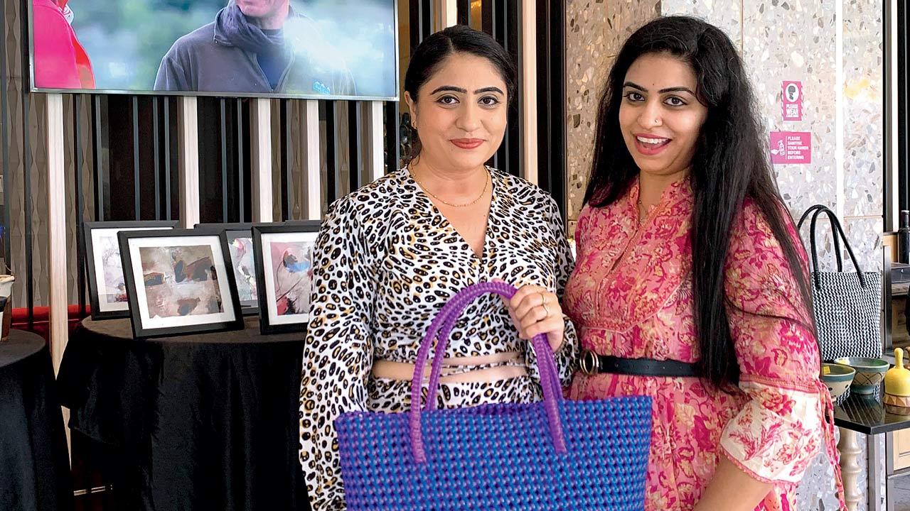 Happy tourists from Chandigarh hold a bag hand woven by visually challenged senior citizens of a local institute and retirement home at last year’s exhibition 