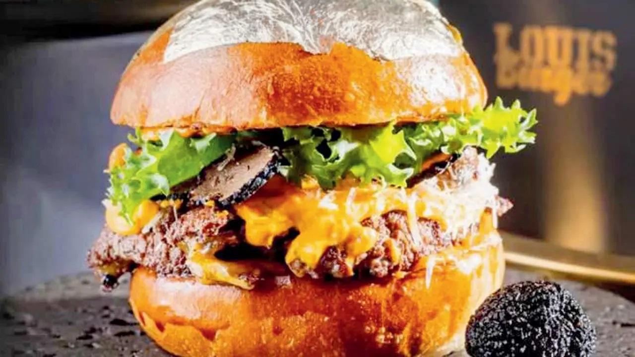 Louis Grand Royale: Garnished with gold varak (foil), this one might be fit for Louis XIV and his pomp. Packed with tenderloin, lamb patty, truffles and shimeji, it comes packed with a combination of flavours to justify its size. At Louis Burger, Kamala Mills Compound, Lower Parel; Veera Desai Industrial Estate, Andheri West. Log on to Swiggy; Zomato Cost Rs 888 onwards