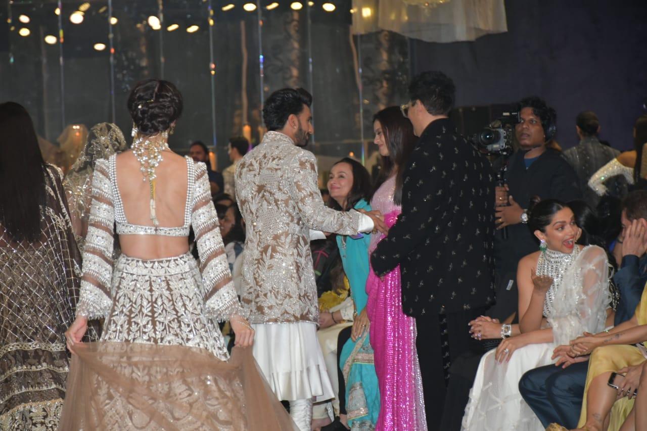 Ranveer Singh greets Karan and Kajol. Deepika is caught in an animated expression