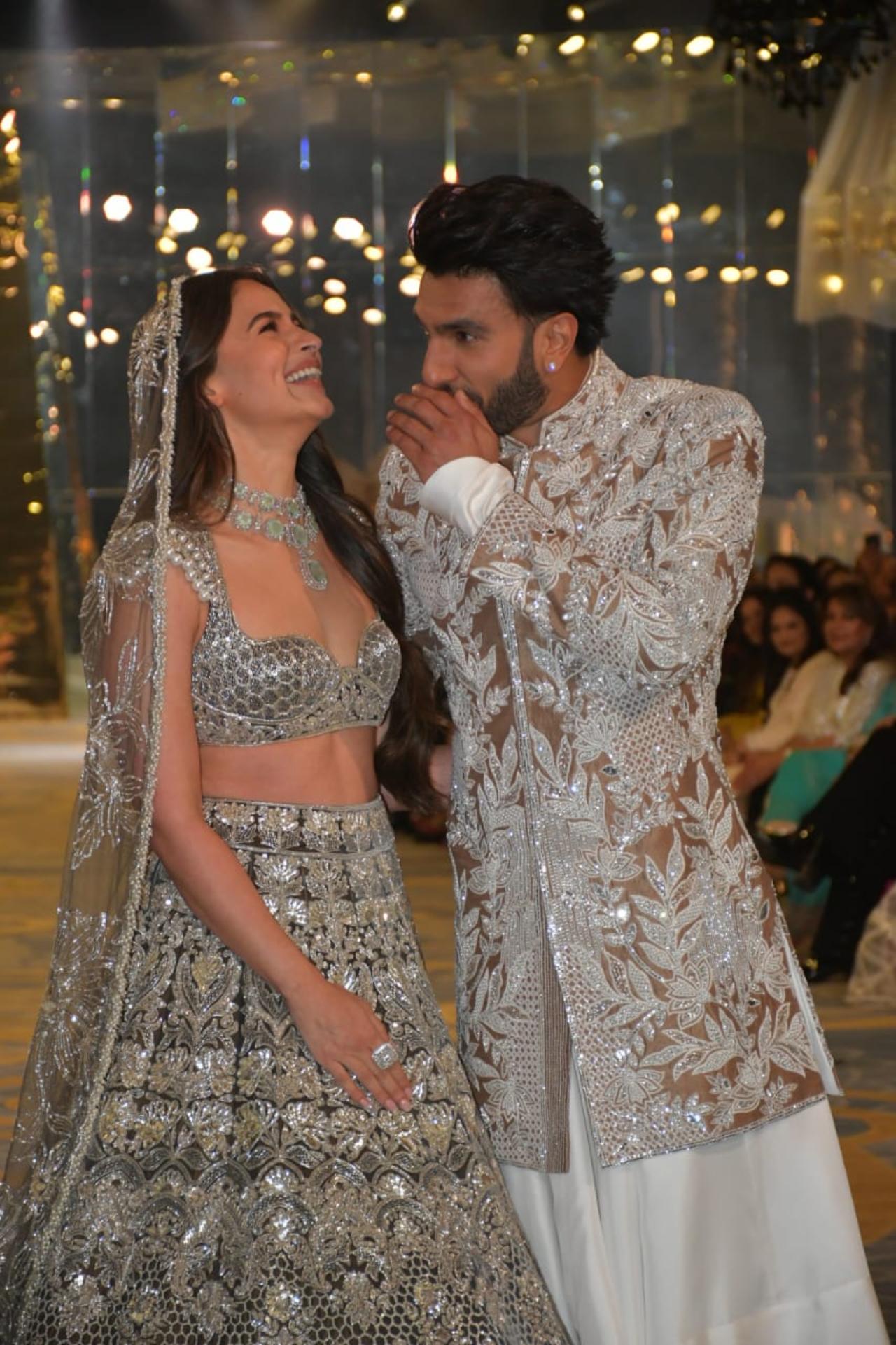 Ranveer Singh and Alia Bhatt have a laugh on the ramp as they walk together