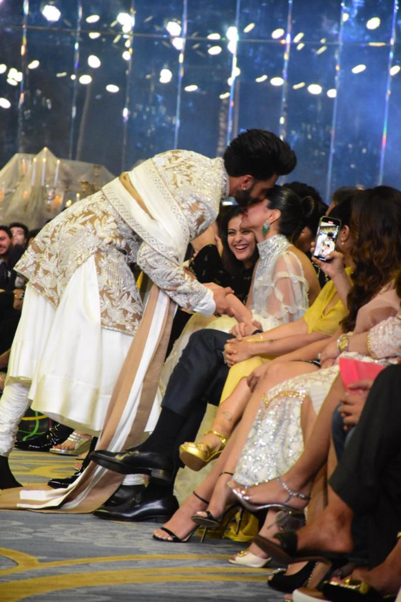 As he walked down the ramp, Ranveer took a detour to greet his wife Deepika Padukone sitting in the audience. Ranveer kissed Deepika and then went on to touch his mother's feet who was also sitting in the audience