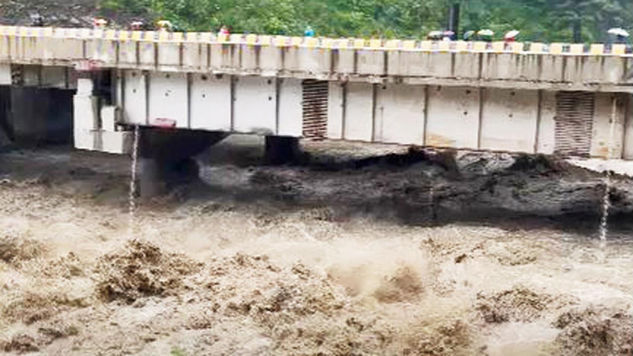 Rough river during a heavy downpour in Manali