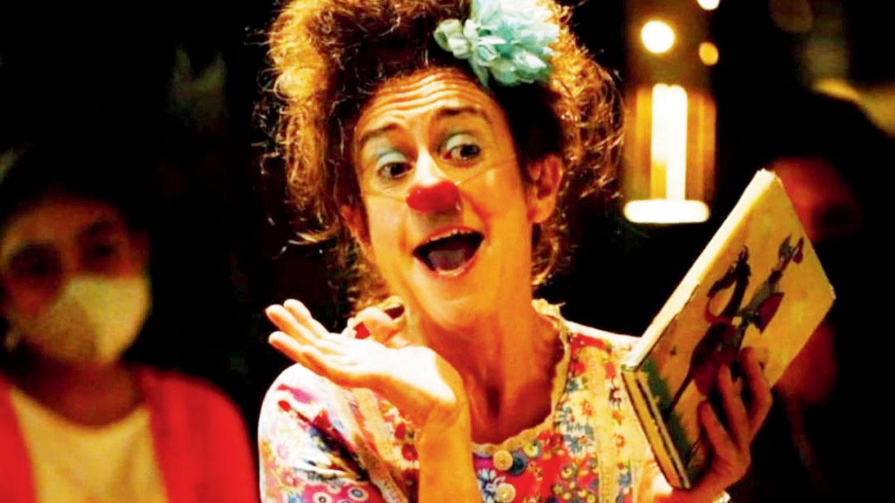 Monica Santos reads from a storybook during one of her performances