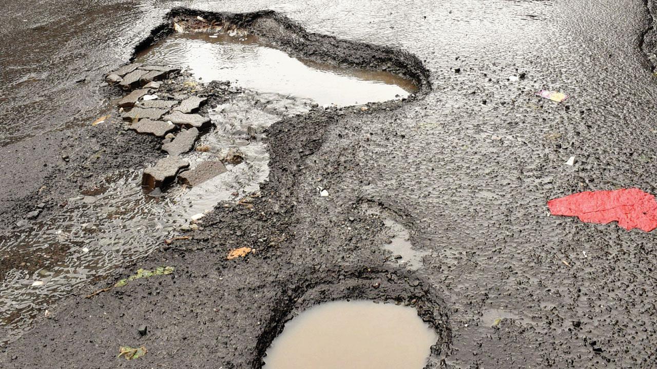 In Photos: Mumbai’s potholes call out the official lie