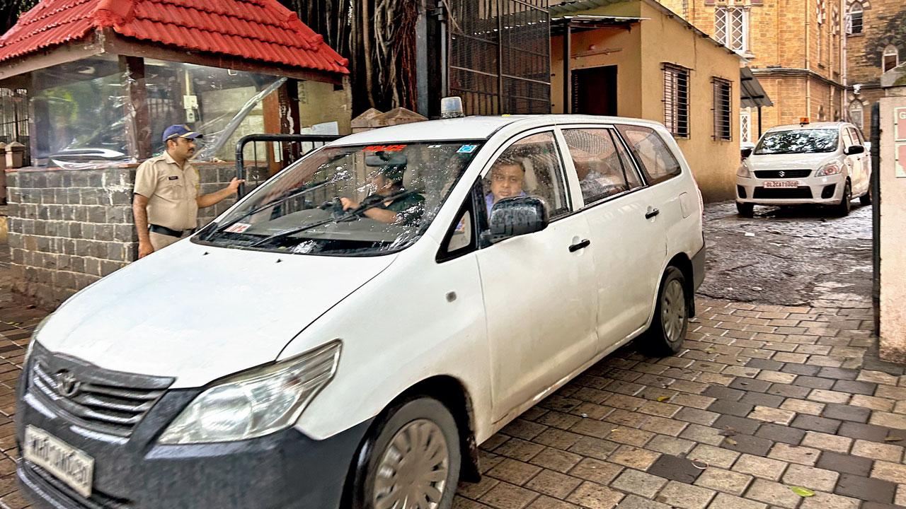 NIA officers leave the court with Siddiqui, on Tuesday