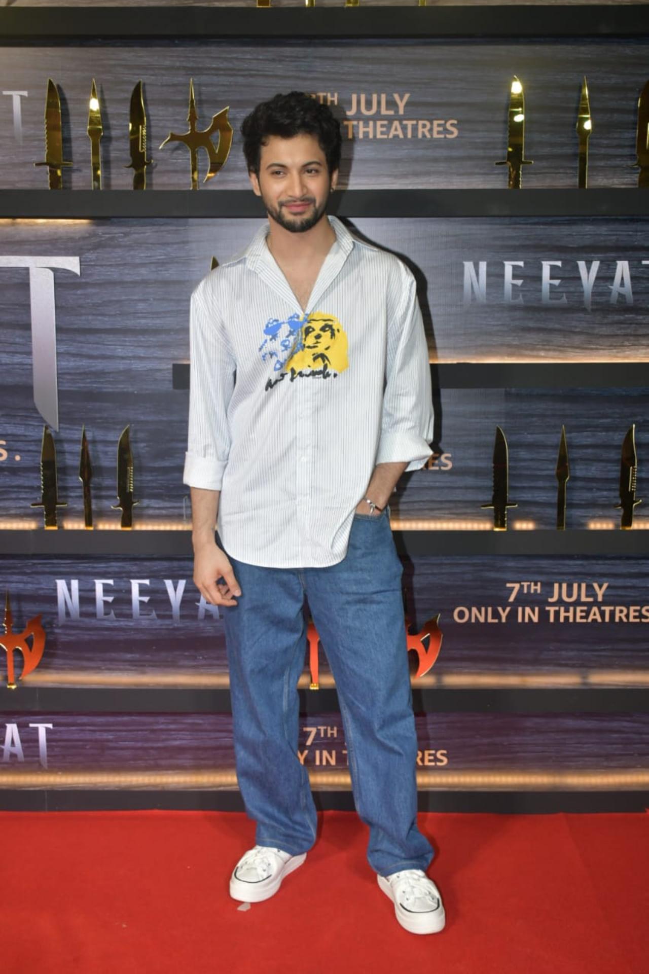 Actor Rohit Saraf sported a white shirt and blue denims for the screening of the film. The actor has worked with Neeyat star Prajakta Koli in the Netflix show 'Mismatched'