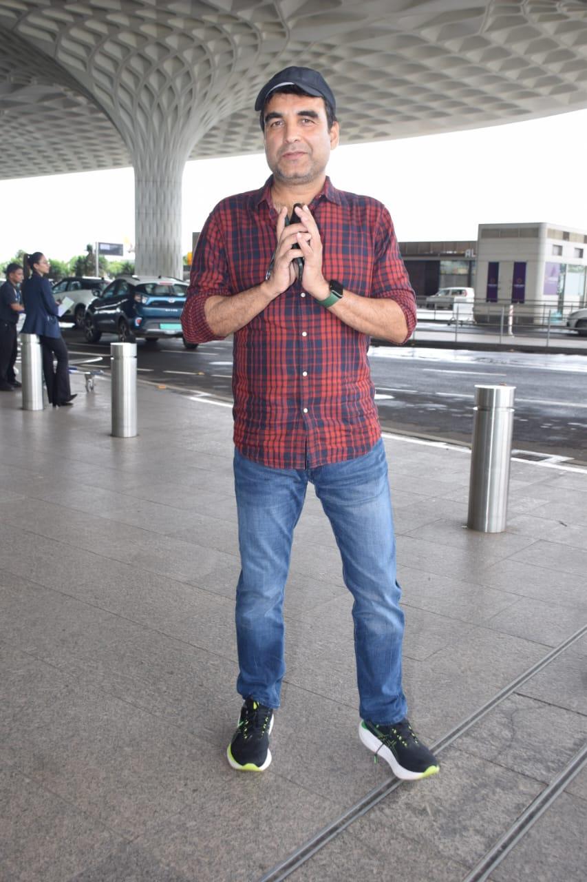 Pankaj Tripathi warmly greets the paparazzi  He was seen at the airport donning a simple flannel shirt and jeans. 