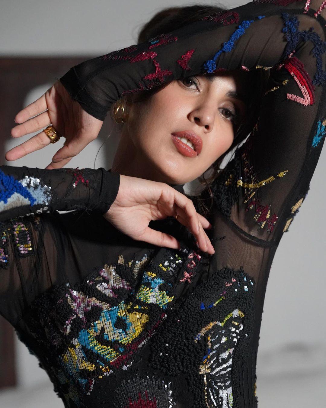 A true fashion moment: Rhea Chakraborty's black-on-black mastery revealed.