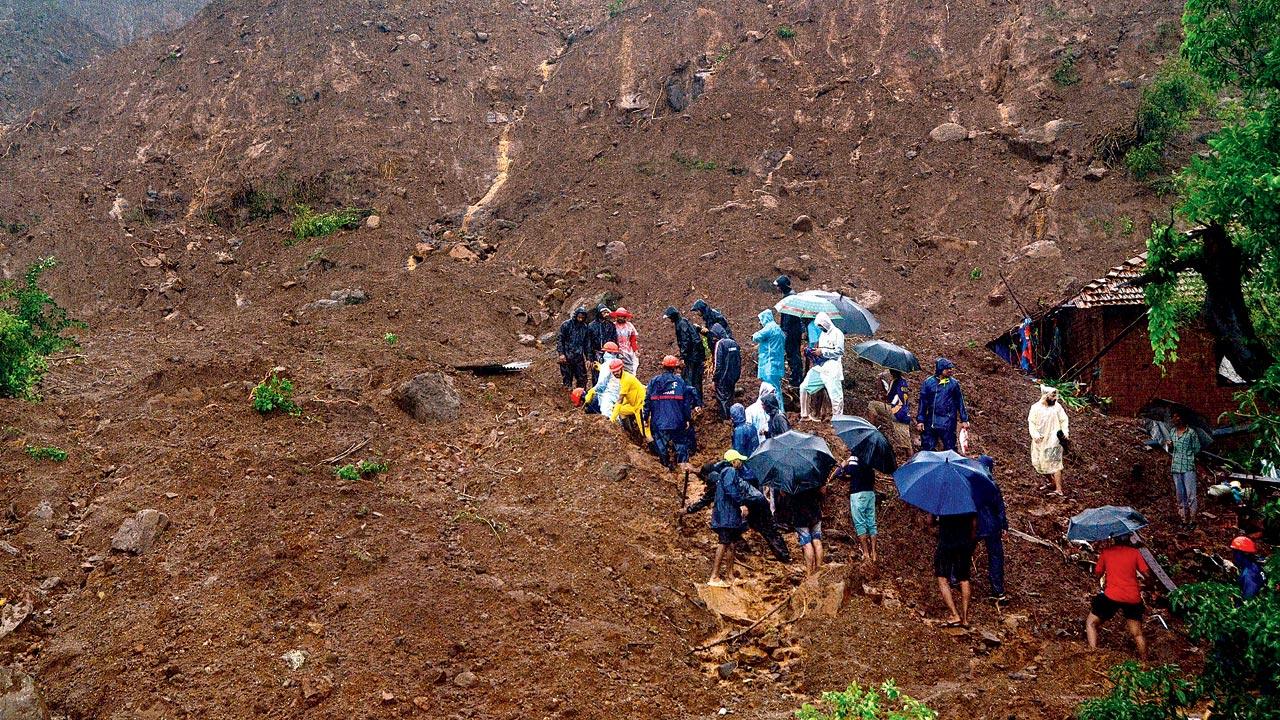 Rescue personnel at the site of the landslide