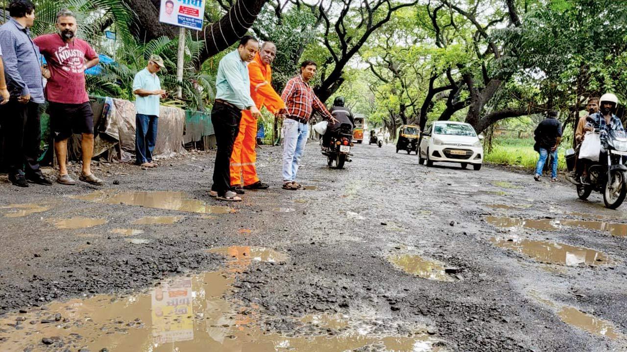Residents hit the streets as craters surface on Aarey road