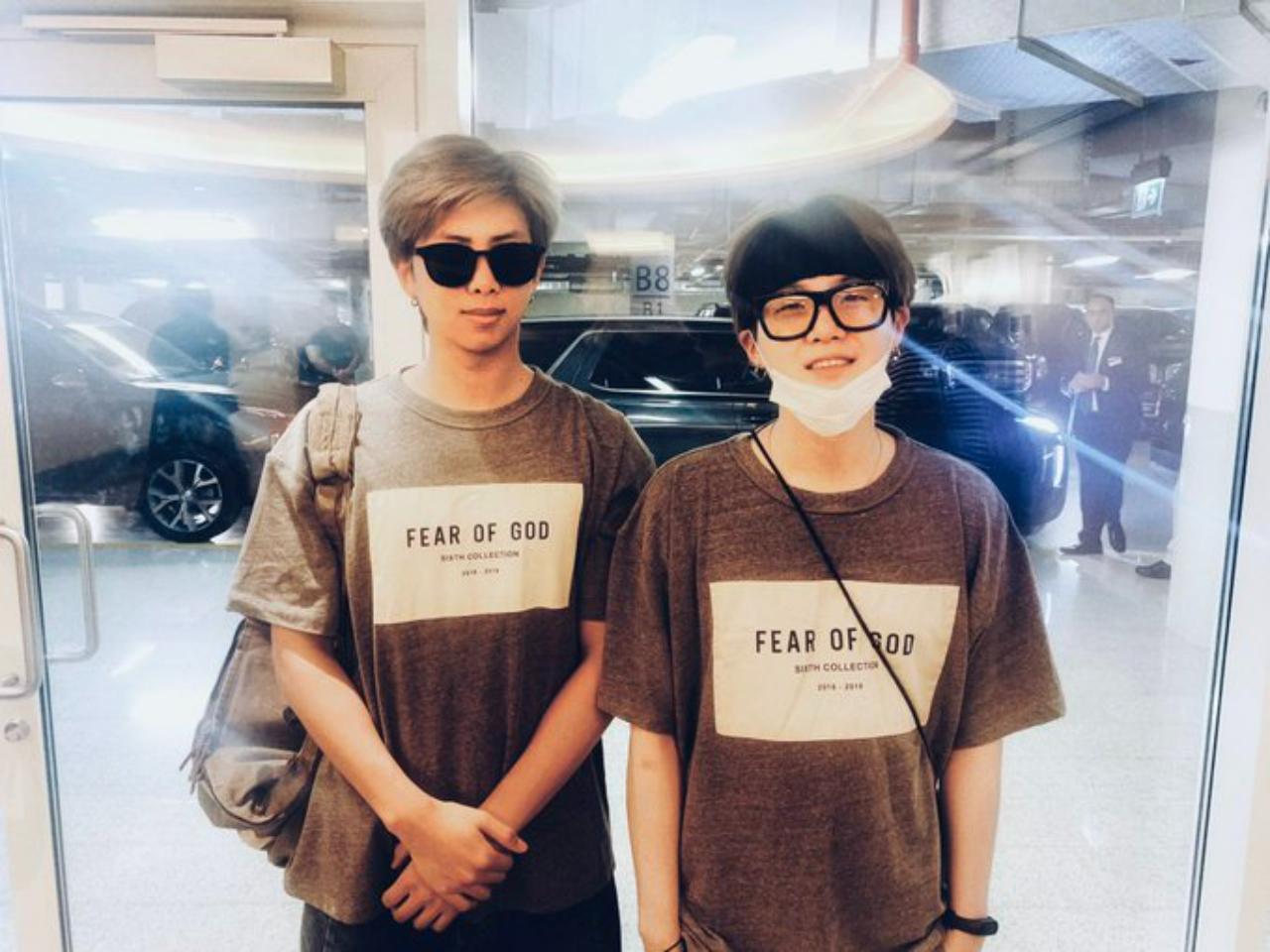Namjoon obediently stands beside his part exasperated, part amused hyung in matching classic t-shirts