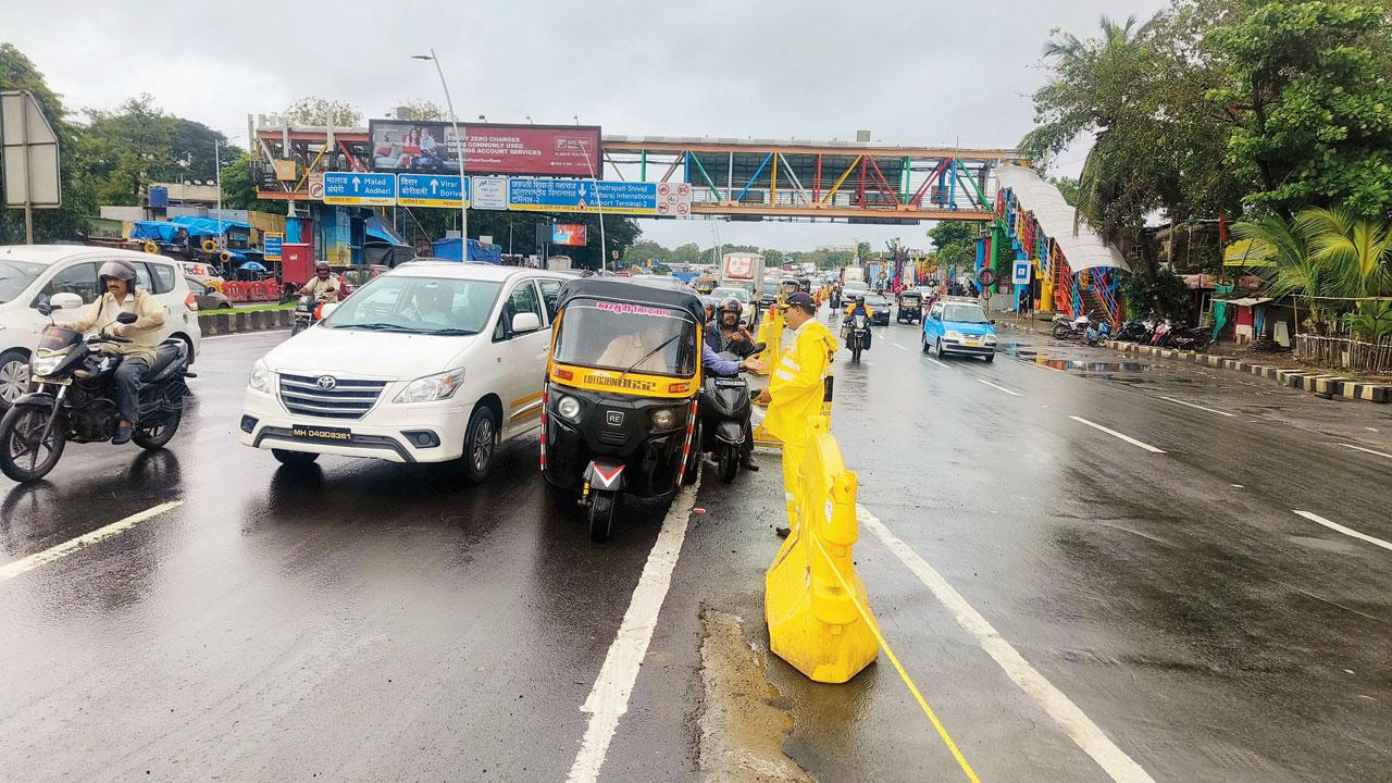 A passenger speaks to a traffic policeman during the blockade