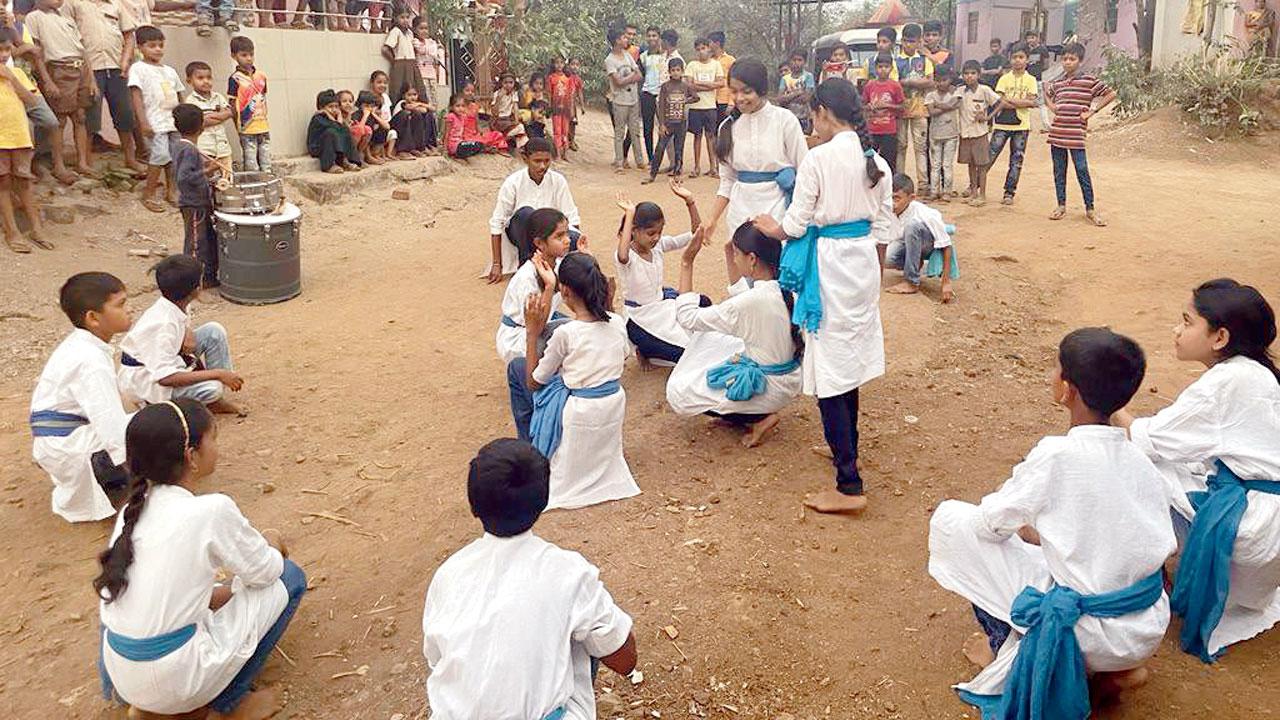 Children perform a street play during an awareness campaign