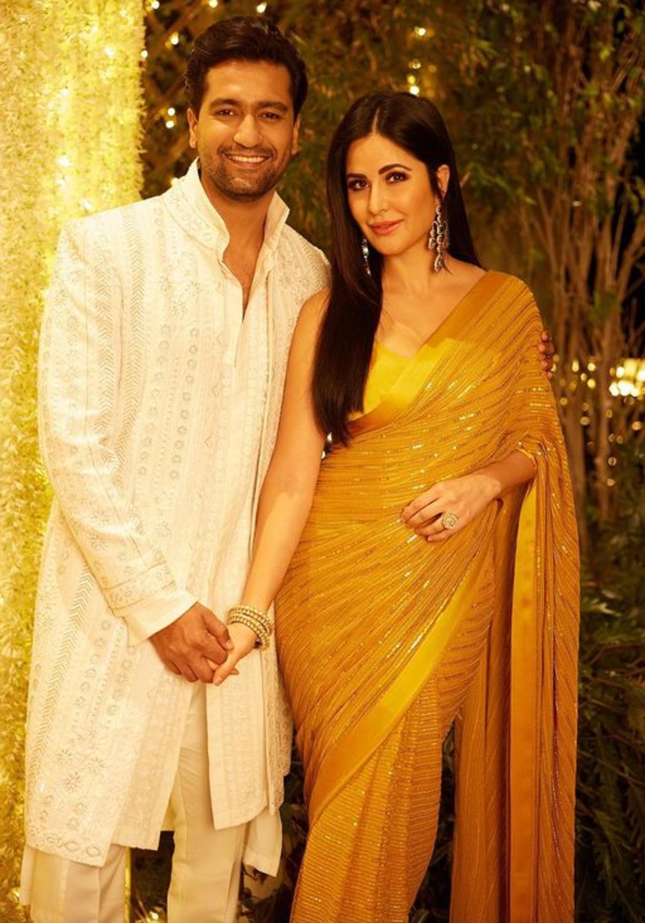 Katrina shared a picture from the couple's Diwali celebration. For her look actress opted for a golden saree whereas Vicky chose a pearl white sherwani
