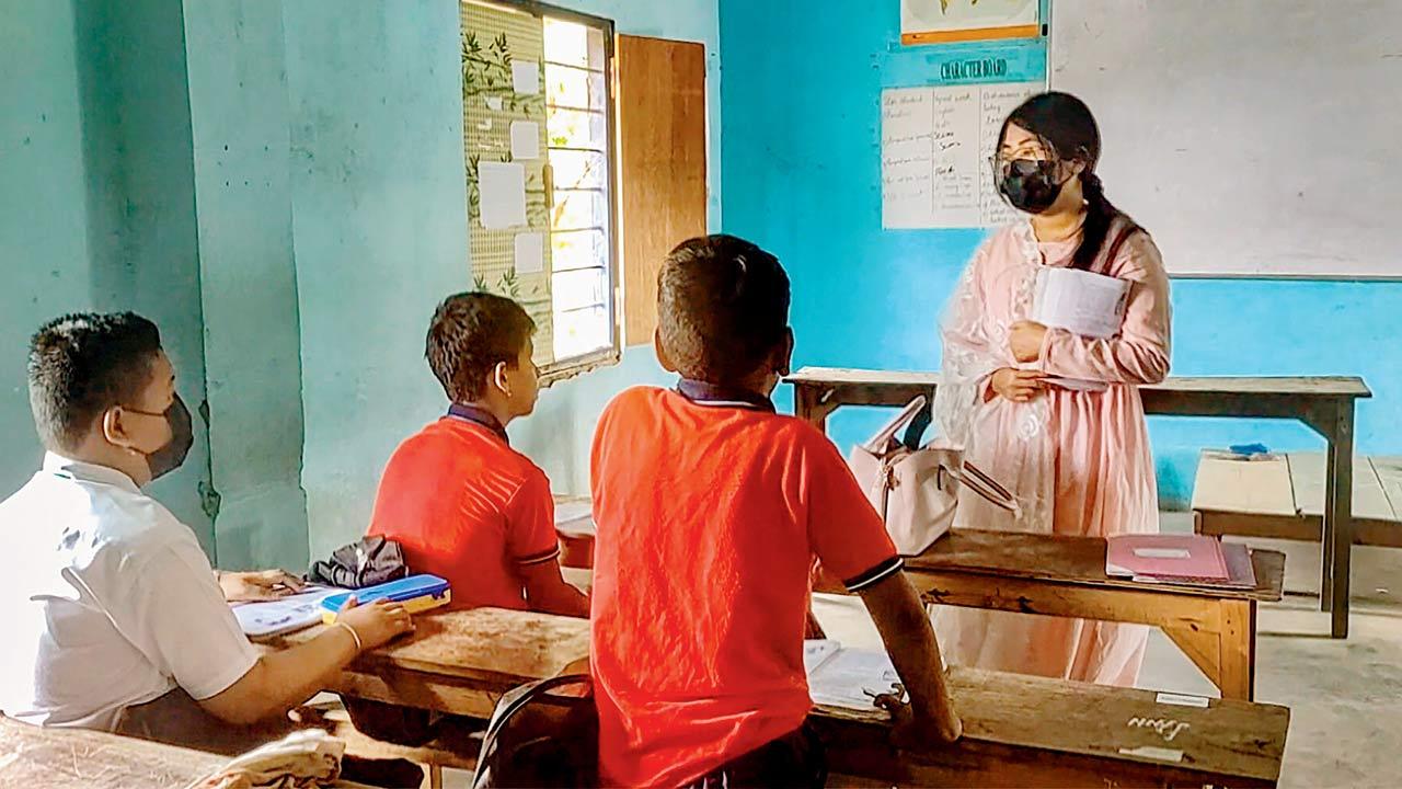Students attend a class at a school, on Wednesday. Pic/PTI