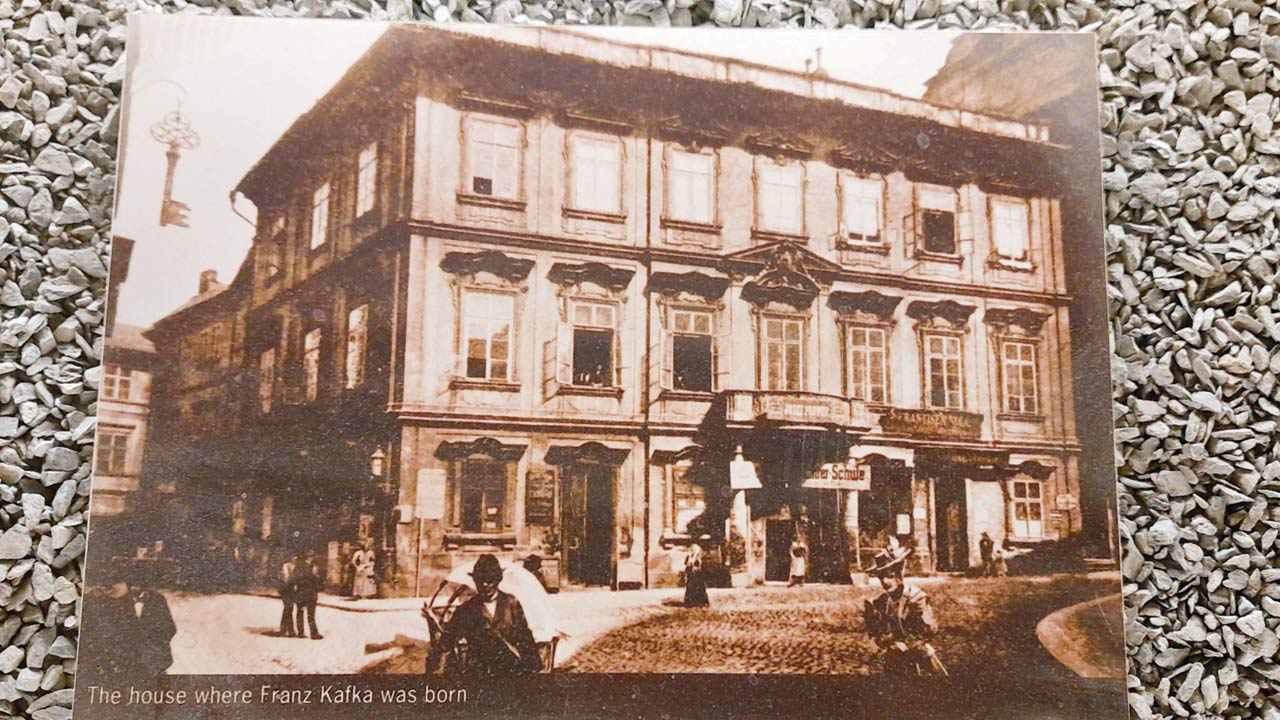 A photo of the original Kafka House is on display at the Kafka Museum