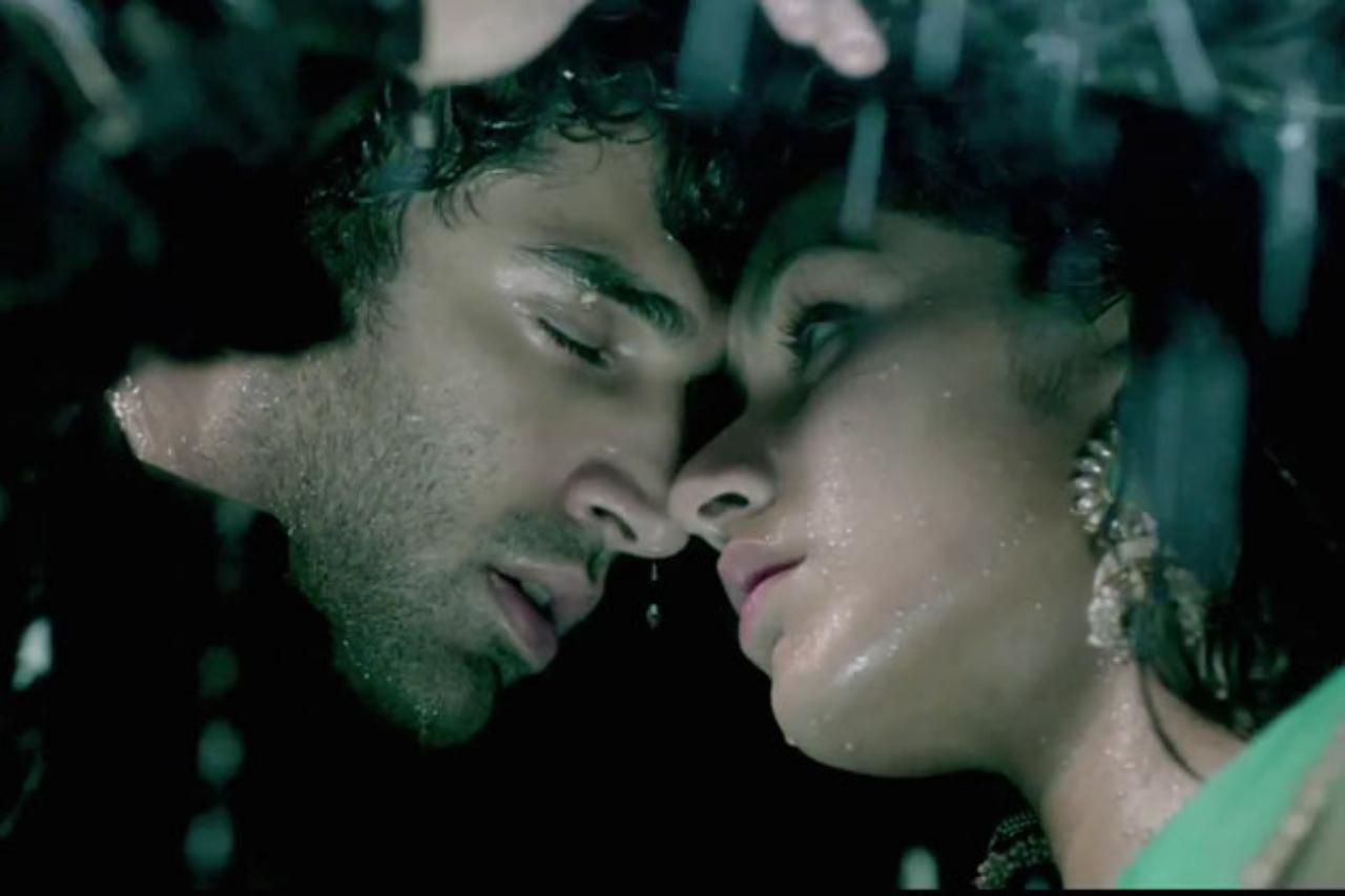 7. Aashiqui 2
The iconic scene from the poster where Rahul and Aarohi stand under the rain with a jacket has become a symbol for romantic couples worldwide. The moment signifies the rainy union of Aditya Roy Kapur and Shraddha Kapoor and epitomizes finding love at the end of angst and longing