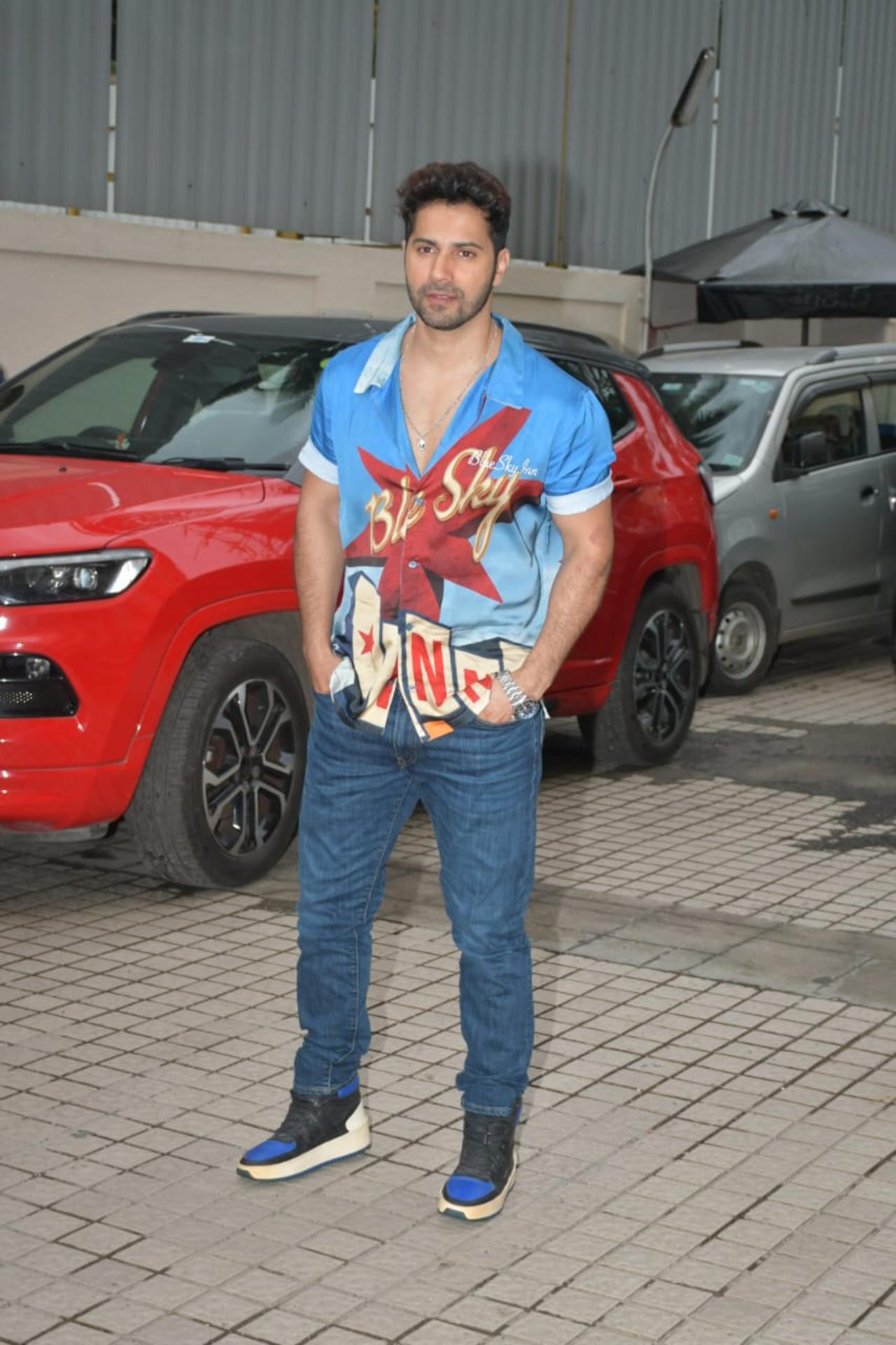 Varun Dhawan kept it casual in a blue printed shirt with denims