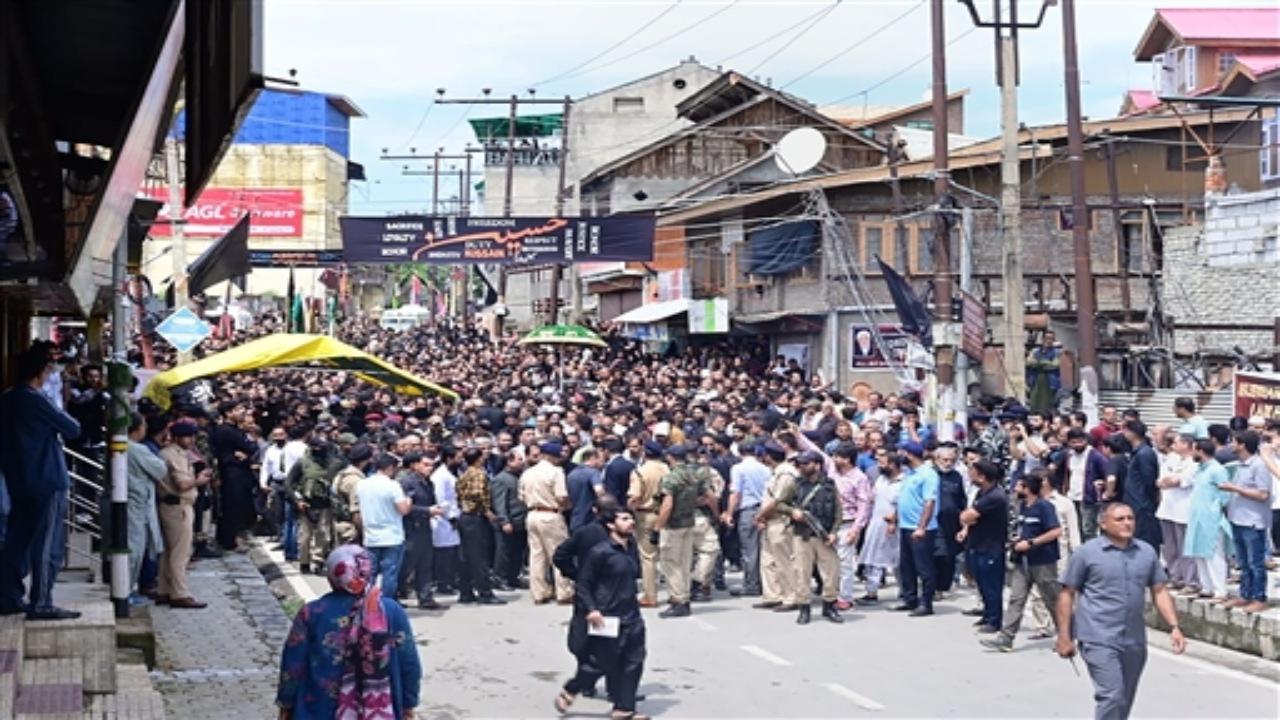 Dressed in a black Kurta, Sinha joined the procession at Bota Kadal in the Zadibal area of Downtown the interior areas of the city, escorted by a tight security cover, they said.