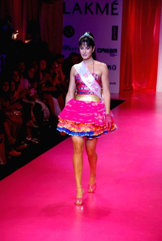 Katrina Kaif walking the ramp for Mattel India, she enchants in a pink dress with a beautifully multi-colored top.