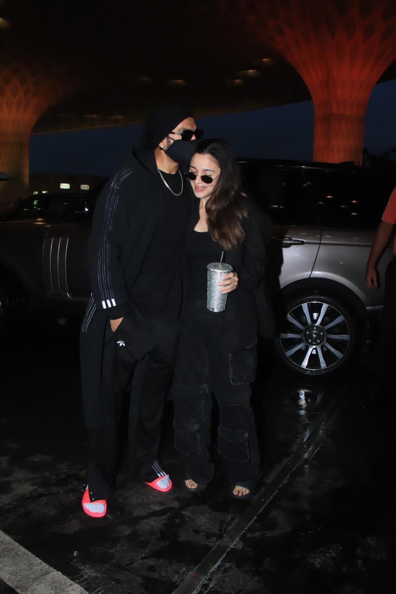 Alia looked chic in a black cargo pants, black camisole and a shirt over it. She was seen holding a beverage cup in her hand. Ranveer, on the other hand, opted for a more athleisure look
