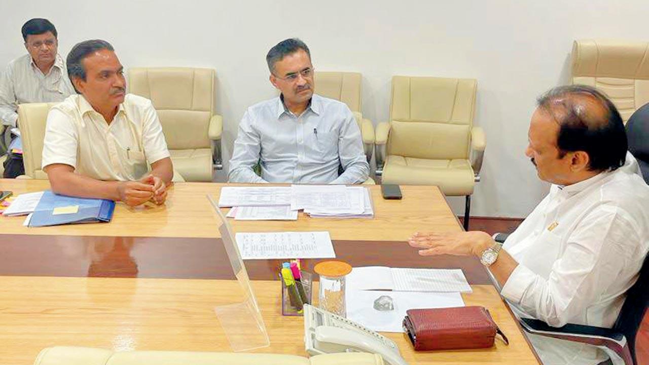 Finance minister Ajit Pawar, who took charge of the department, seen with senior officials at his Mantralaya office 