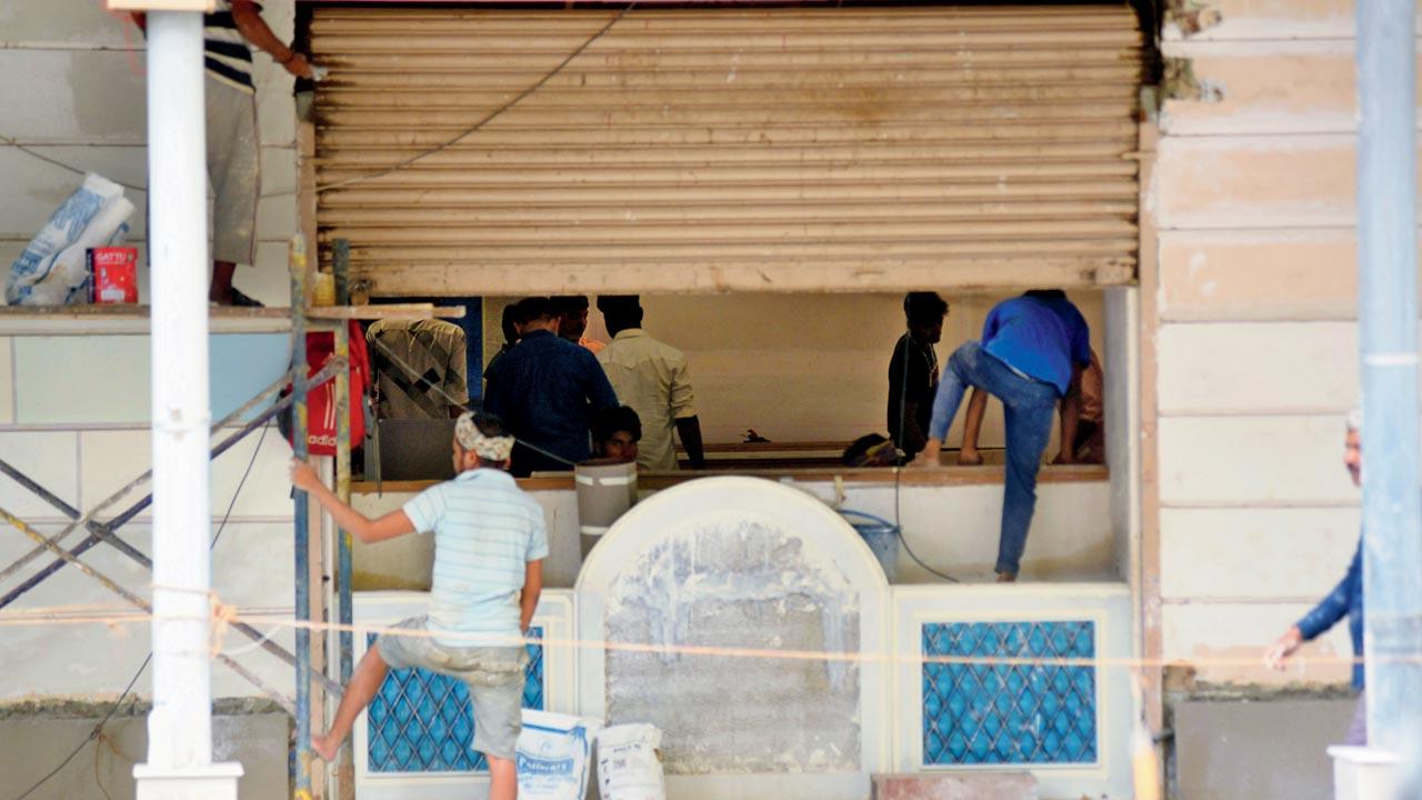 Construction workers inside a partially closed space that is a part of the dairy. Pics/Sameer Markande