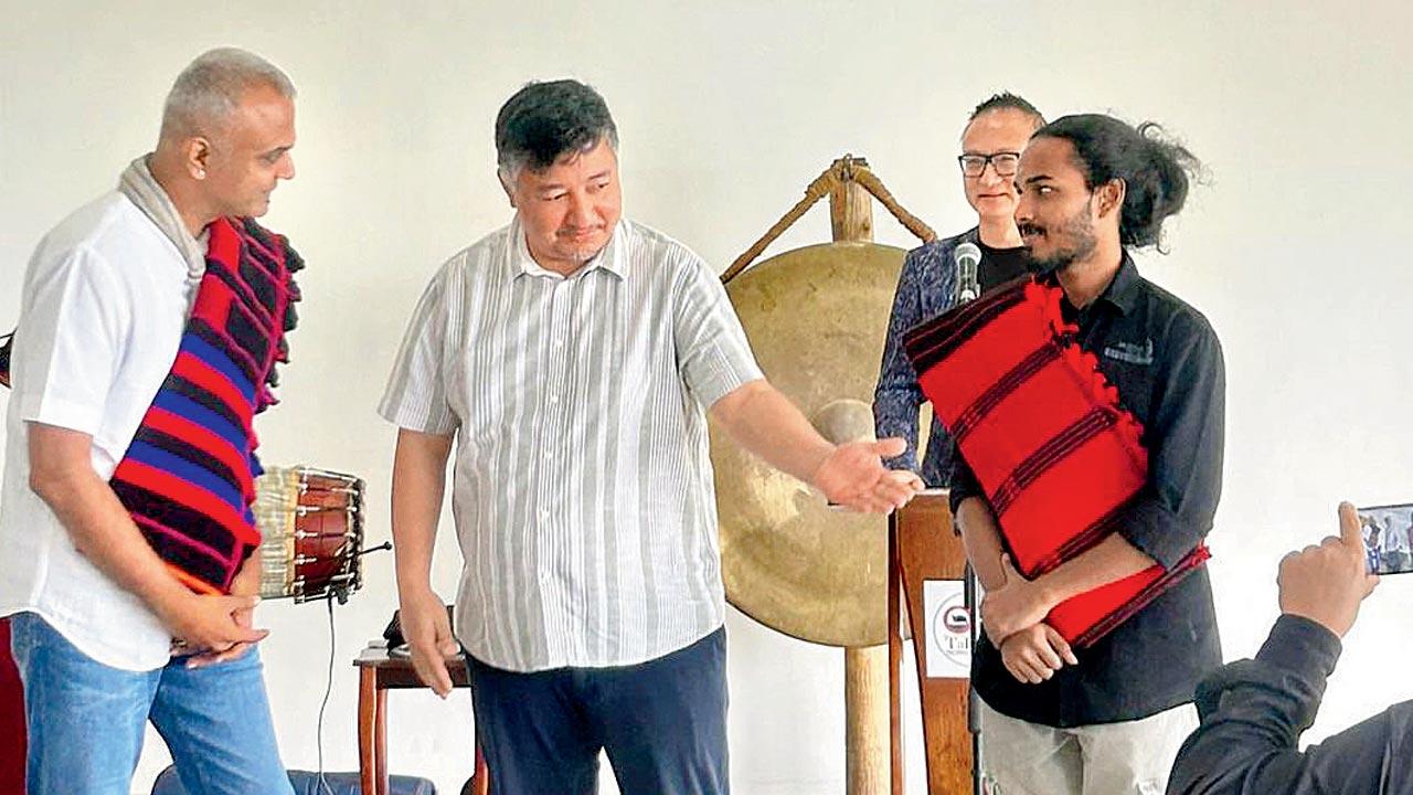 Rajagopalan (left) felicitated by Abu Mehta, advisor to the chief minister of Nagaland