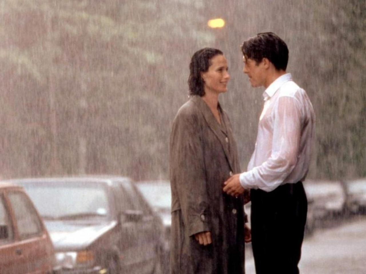 Four Weddings and a Funeral
The beloved British film, Four Weddings and a Funeral, reaches its climax as Andie MacDowell and Hugh Grant's characters break free from their mismatched partners and confess their love for one another. This heartwarming moment serves as a memorable conclusion to the movie. And it takes place in...you guessed it, the rain! Well come on, it's England