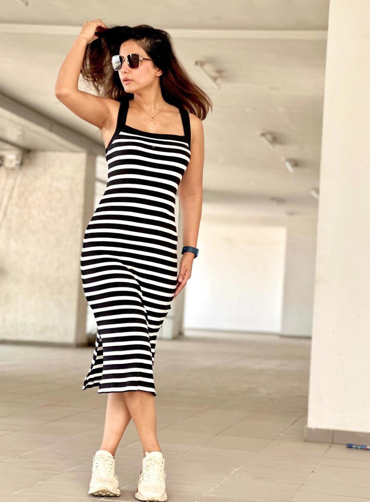 Hina Khan added some patterns to her fitted black and white outfit with matching white shoes