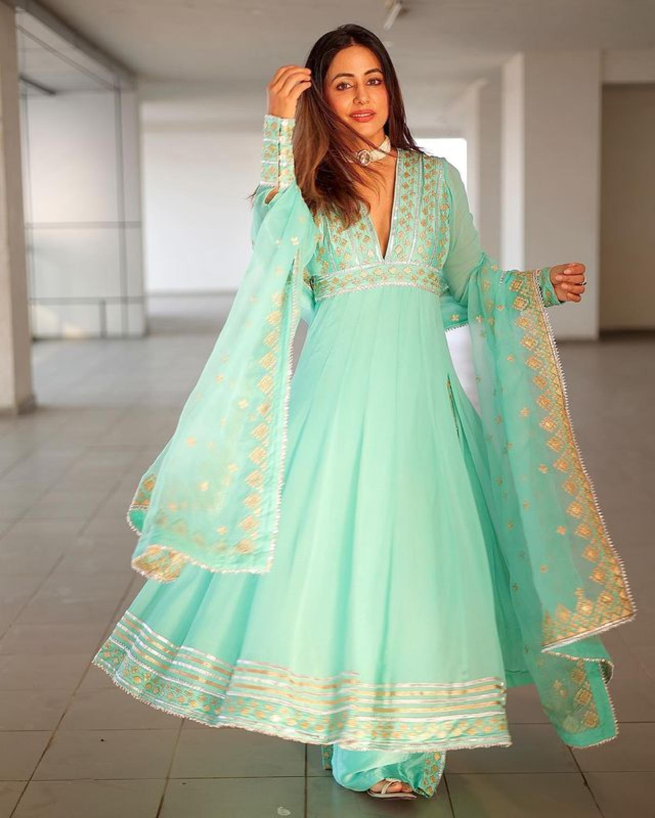 The actress looks beautiful in a deep neck sea-green palazzo suit
