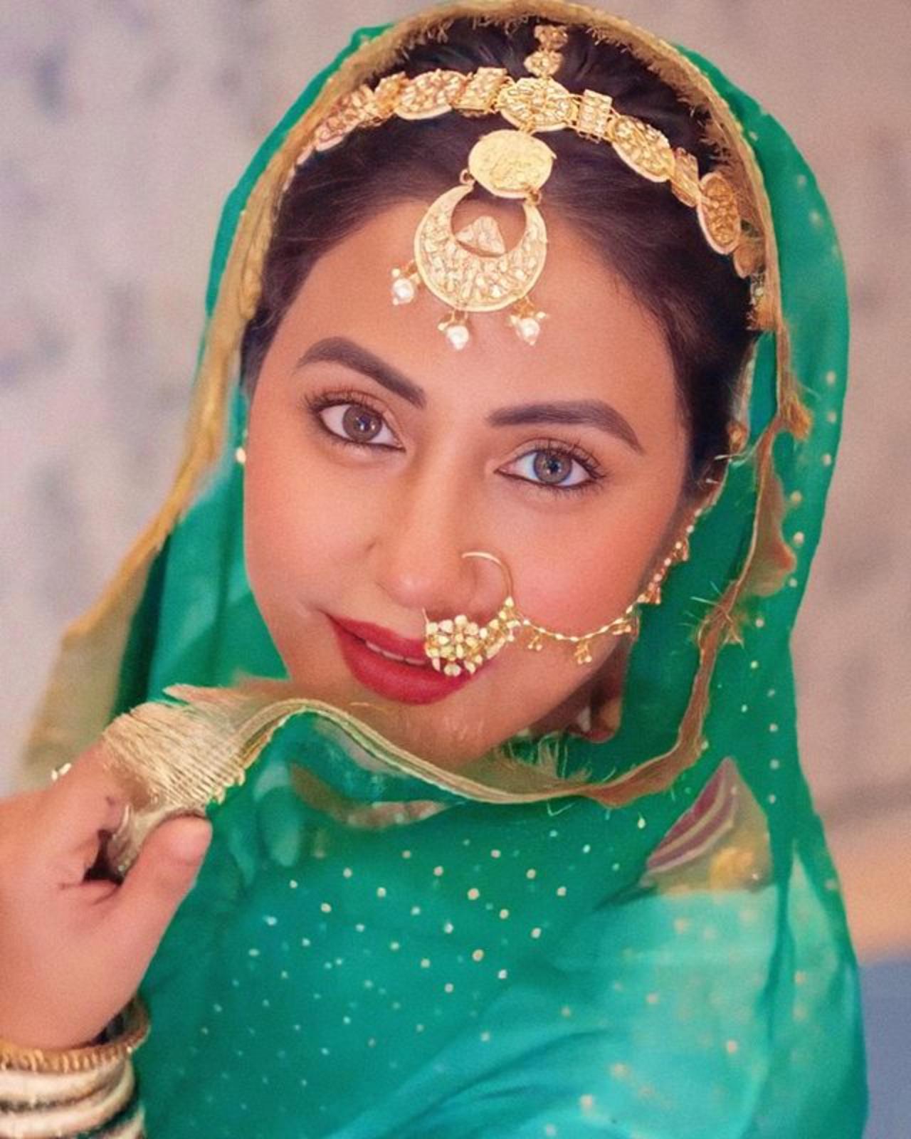 Hina opted for a mang-teeka and bold makeup to finish her Punjabi look