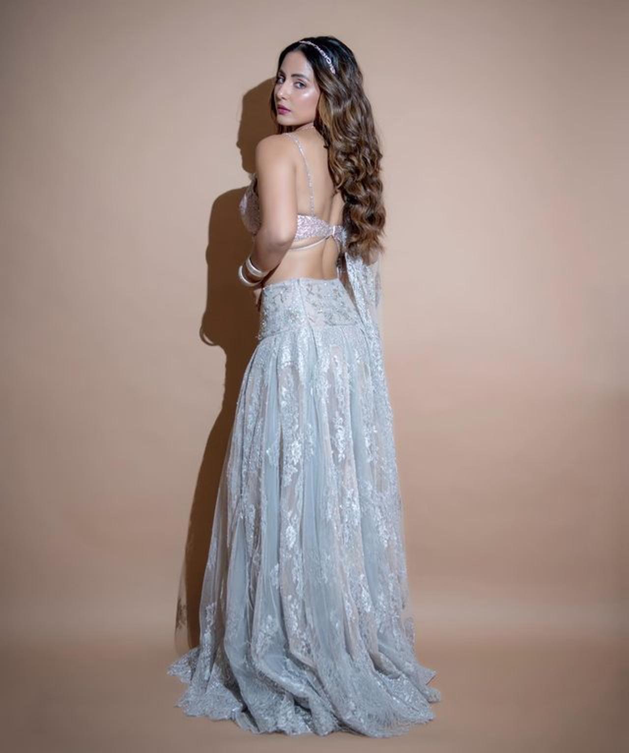 The backless blouse elevated her entire appearance 