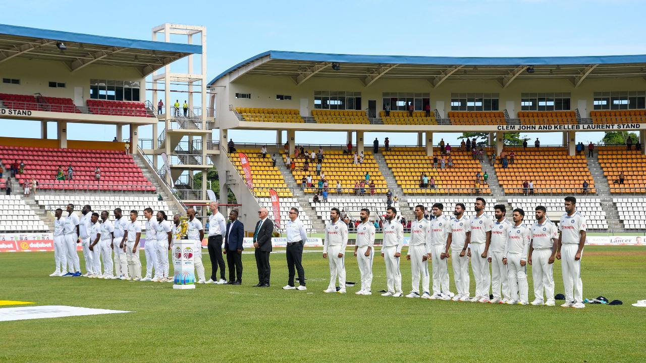India players (R) and West Indies players (L) on Day of of first Test match in Dominica