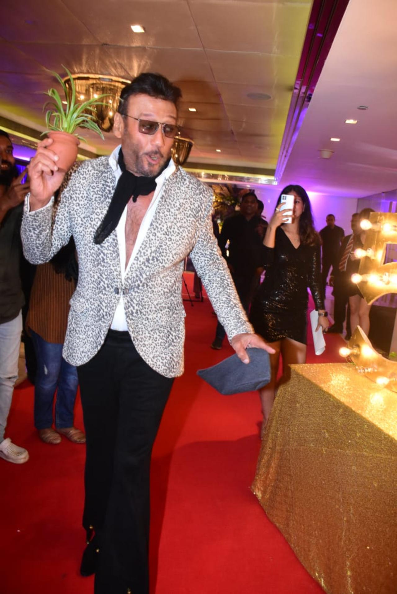 Jackie Shroff was one of the few guests who seemed to playfully 'break' the black dress code of the party. He seemed to be the life of the party in his grey leopard print jacker and black neck scarf