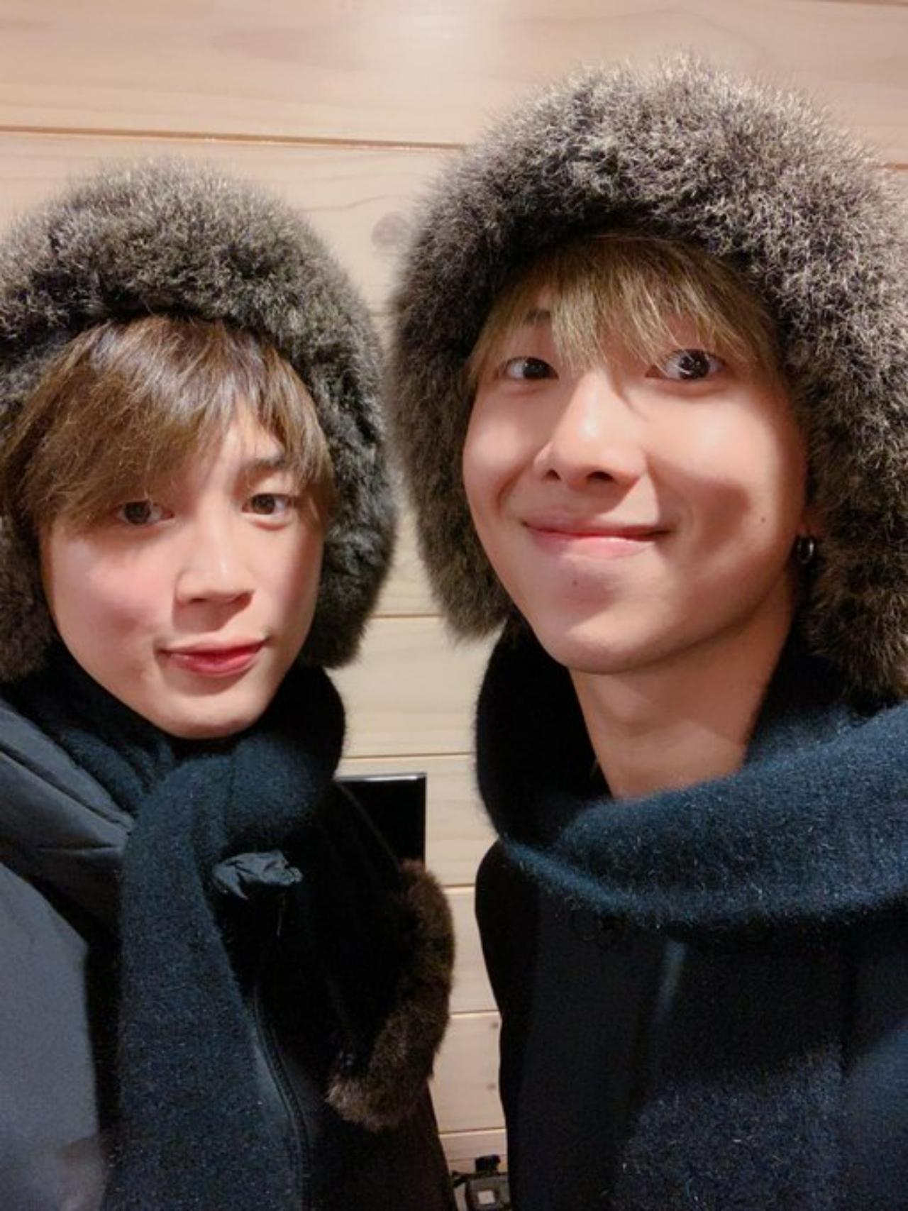 Cuteness overload! Namjoon and Jimin cosy up for the winter in matching jackets, mufflers and the most adorable fur winter caps