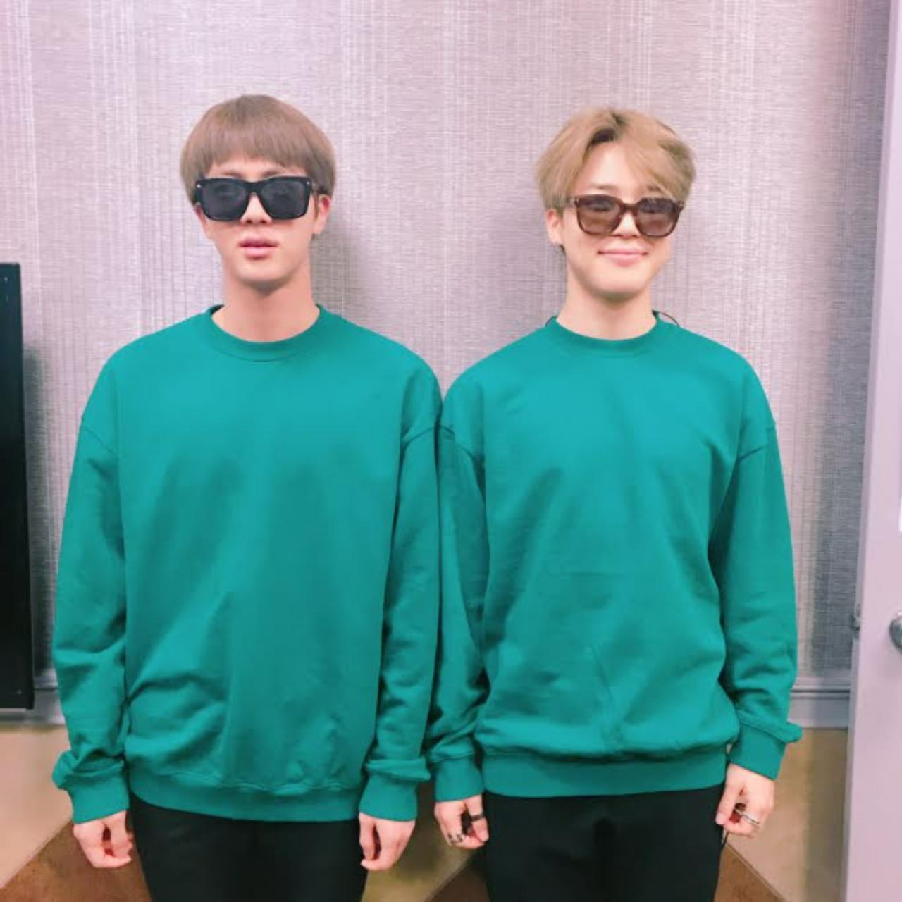 Jin seems to have convinced Jimin to post a dad-joke style post to make ARMYs’ day. They stand side by side in basil-coloured sweatshirt and sunglasses. Jin looks equal parts hilarious and adorable in his (accidental) high-fringe bowl cut