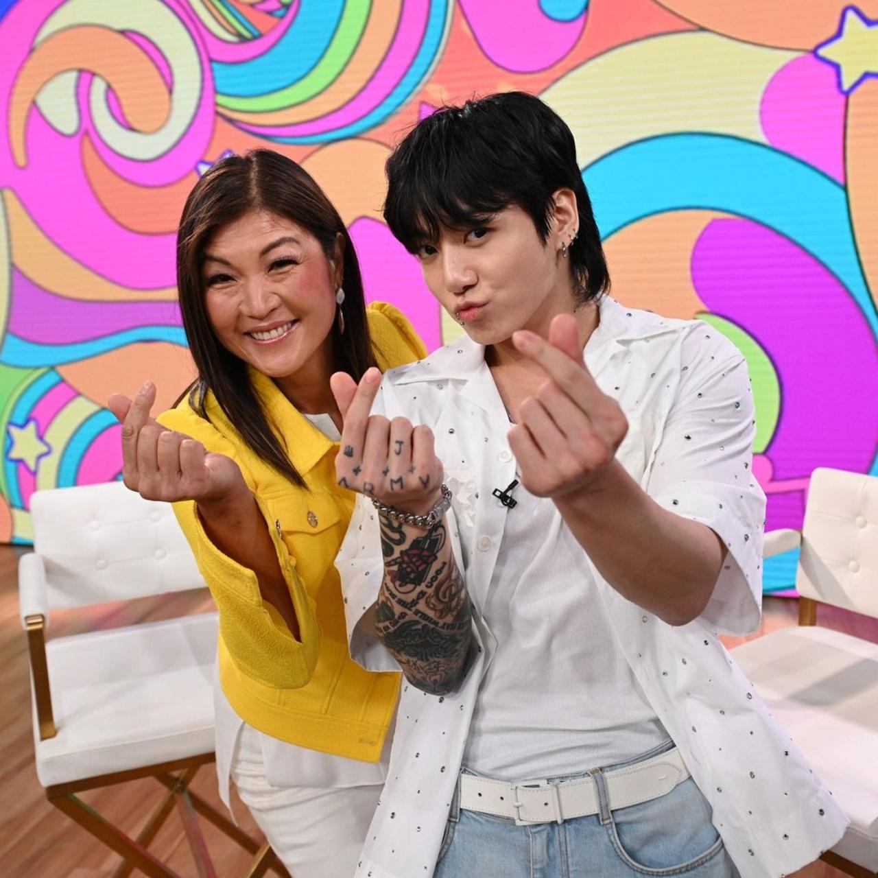 And the hearts keep on coming! Jungkook cutely poses with his interpreter JuJu Chang