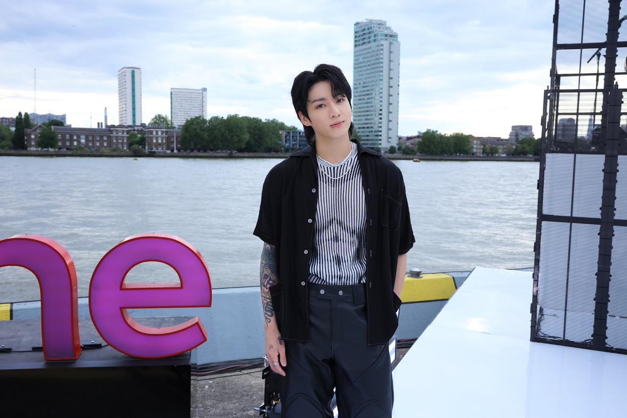 Jungkook can seamlessly transition from his casual style into something more elegant. The artist recently released his solo digital single 'Seven' and engaged in several promotional activities in the US and UK. For his BBC One show, he was styled in a sleek black-and-white striped silk shirt, pants and open-buttoned jacket. That shirt might be creating an optical illusion, but Jungkook is all we are looking at (well, what else do you expect?)
