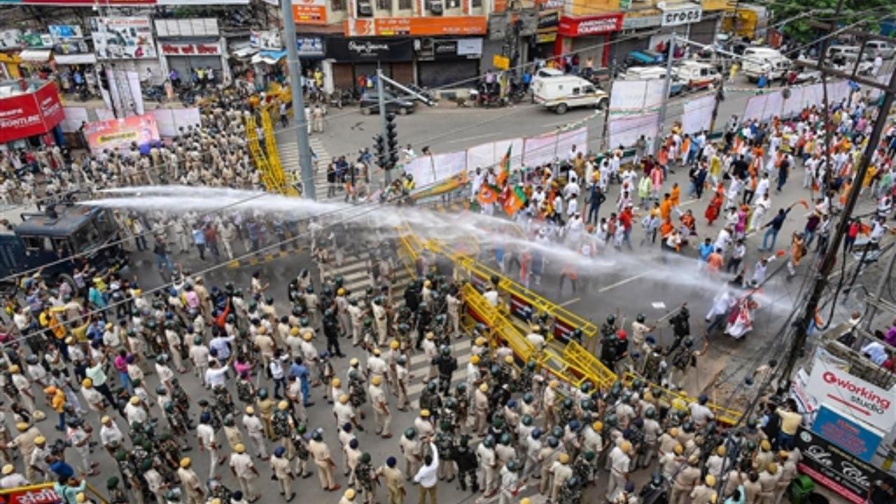 BJP workers, many of them wearing saffron kurtas, saris, salwar suits and bandanas, walked waving the party flag while some were perched atop a 